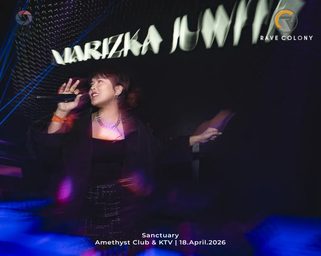 Female singer performing on stage with a handheld mic, under colorful club lighting; event caption reads 'Sanctuary Amethyst Club & KTV | 18.April.2026' in the foreground.