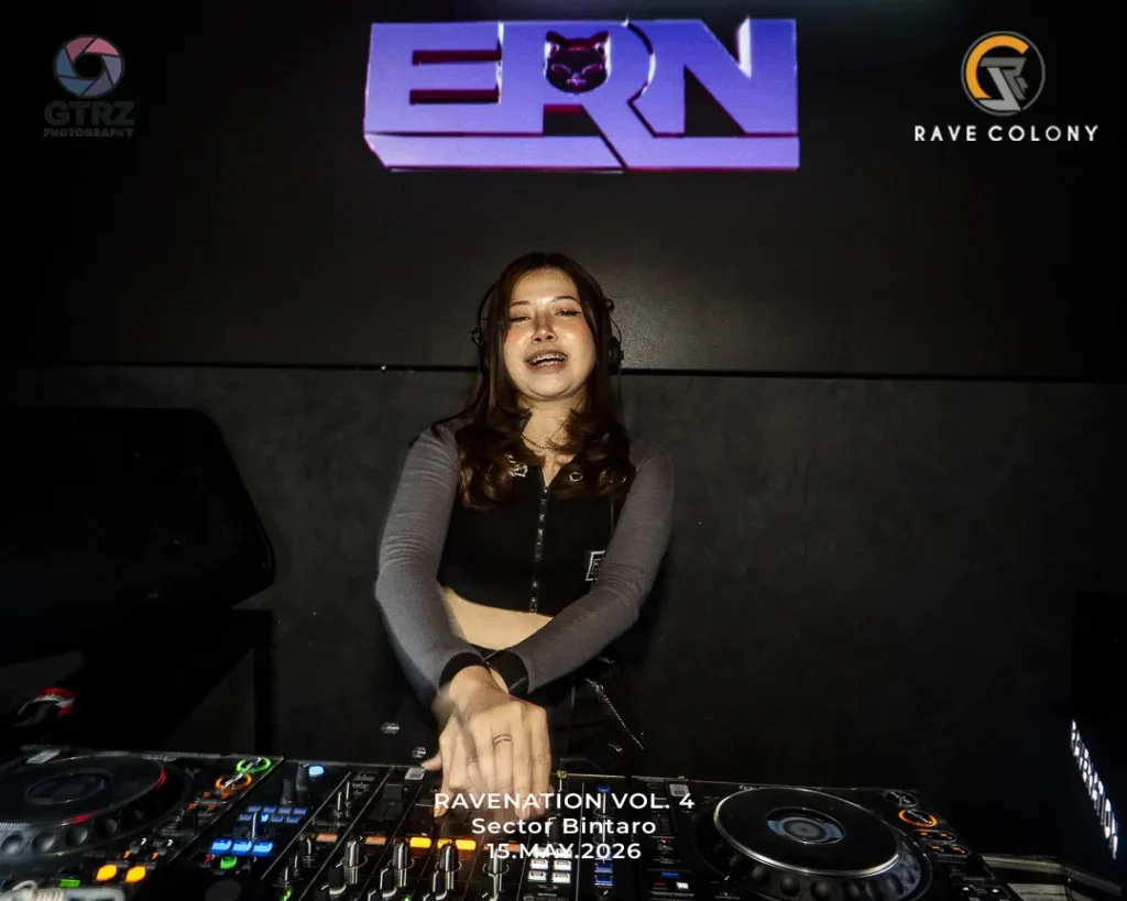 Female DJ performing at a booth, wearing headphones, with event text 'RAVENATION VOL.4 Sector Bintaro 15 May 2026' visible at bottom. Logos for GTRZ and Rave Colony flank the stage.