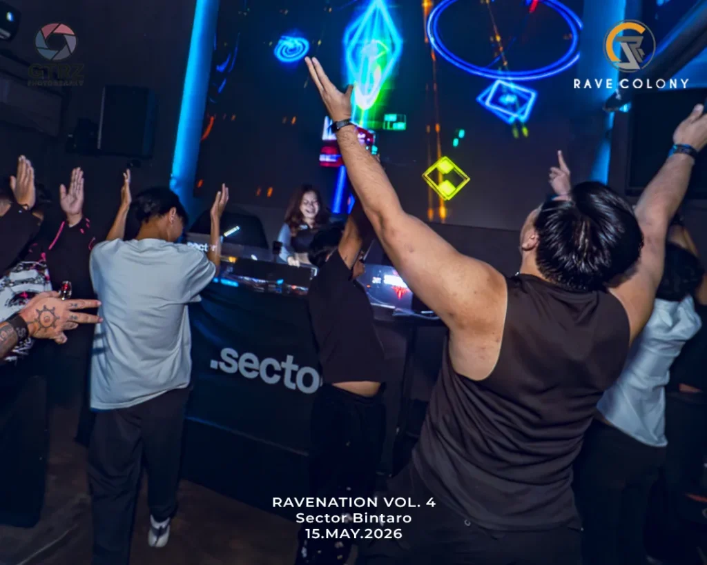 Crowd at a nightclub with raised hands in front of a DJ booth and neon geometric light projections; event text at bottom reads Ravenation Vol. 4, Sector Bintaro, 15 May 2026.