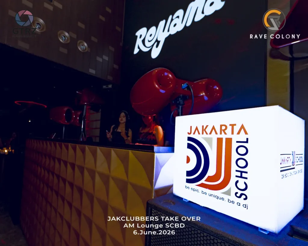 Nightclub scene with a white illuminated Jakarta School cube on a speaker, two women at a DJ booth, large red decorative speakers in the background, and logos on the walls; bottom overlay reads 'JAKCLUBBERS TAKE OVER AM Lounge SCBD 6.June.2026'