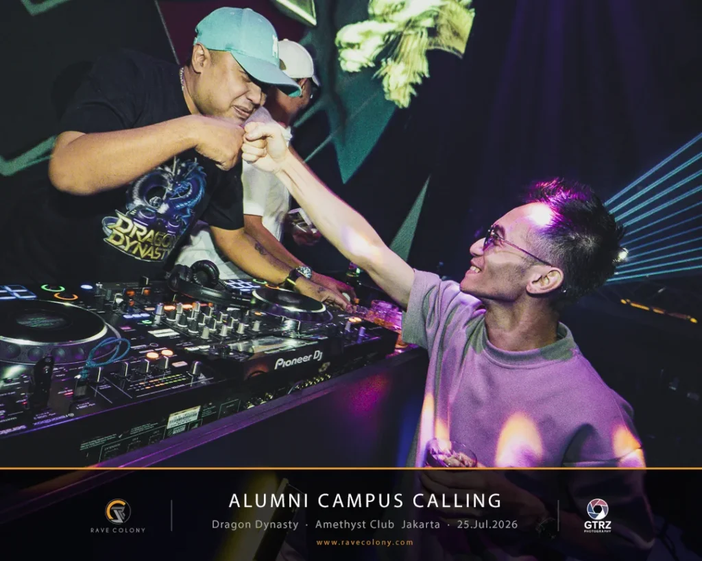 Two DJs fist-bump over a busy mixing console in a club, neon lights and tech gear visible around them.